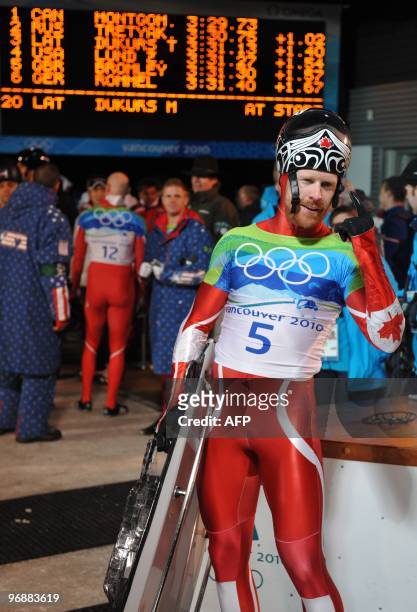 Canada's Jon Montgomery celebrates winning gold in the men's Skeleton final at the Whistler Sliding Centre during the Vancouver Winter Olympics on...