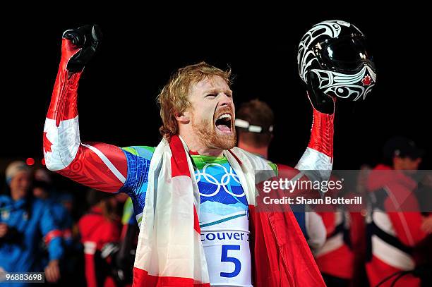 Jon Montgomery of Canada celebrates winning the gold medal during the flower ceremony for the men's skeleton on day 8 of the 2010 Vancouver Winter...