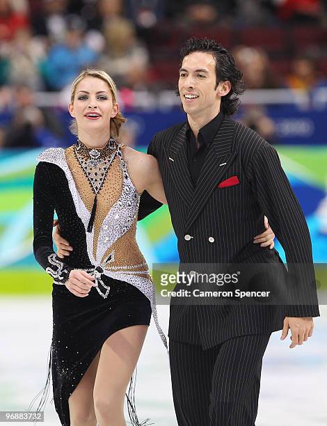 Tanith Belbin and Benjamin Agosto of United States skate off the ice after their performance in the Figure Skating Compulsory Ice Dance on day 8 of...