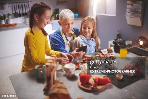 family in the kitchen - extreme dieting stock pictures, royalty-free photos & images