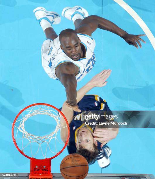 Emeka Okafor of the New Orleans Hornets goes up for a block against Mike Dunleavy of the Indiana Pacers on February 19, 2010 at the New Orleans Arena...