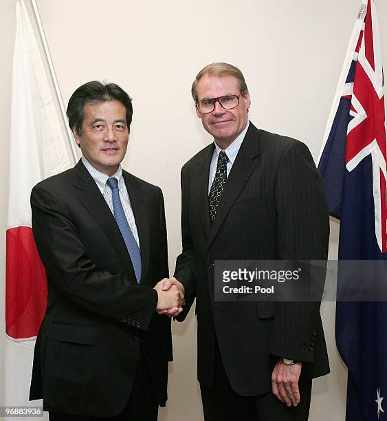 Japan's Minister For Foreign Affairs Katsuya Okada shakes hands with Australian Minister for Defence John Faulkner at the Commonwealth Parliamentary...