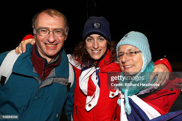 Amy Williams of Great Britain and Northern Ireland poses for a photo with her father Ian and mother Jan after she won the gold medal in the women's...