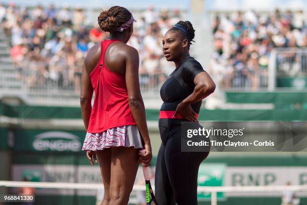 June 3. French Open Tennis Tournament - Day Eight. Serena Williams and Venus Williams of the United States in action against Andreja Klepac of...