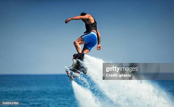 flyboarding. - hoverboard water stock pictures, royalty-free photos & images