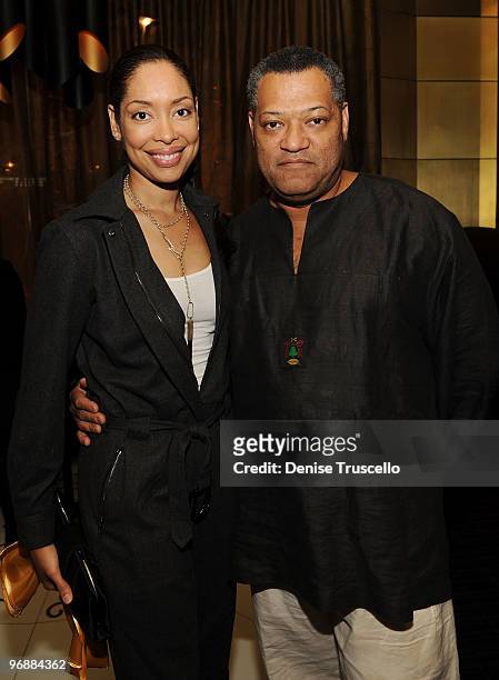 Gina Torres and Laurence Fishburne attend the reception for the world premiere of Cirque du Soleil's "Viva ELVIS" at Aria in CityCenter on February...