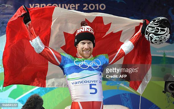 Canada's Jon Montgomery celebrates winning gold in the men's Skeleton final at the Whistler Sliding Centre during the Vancouver Winter Olympics on...