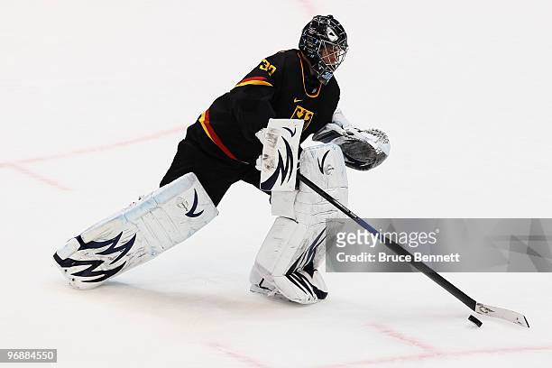Goalkeeper Dimitri Patzold of Germany handles the puck during the ice hockey men's preliminary game between Finland and Germany on day 8 of the...