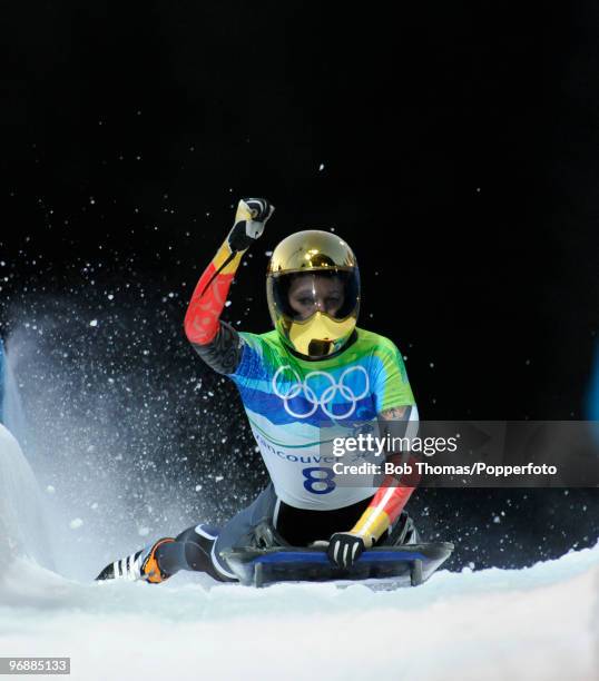 Anja Huber of Germany reacts after completing her run in the competes in the women's skeleton fourth heat on day 8 of the 2010 Vancouver Winter...