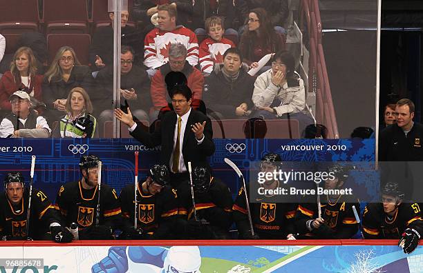 Head coach Uwe Krupp of Germany looks on from the bench during the ice hockey men's preliminary game between Finland and Germany on day 8 of the...
