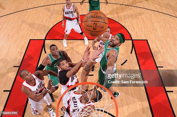 Marcus Camby, Nicolas Batum and Dante Cunningham of the Portland Trail Blazers grab for the rebound against Rasheed Wallace of the Boston Celtics...