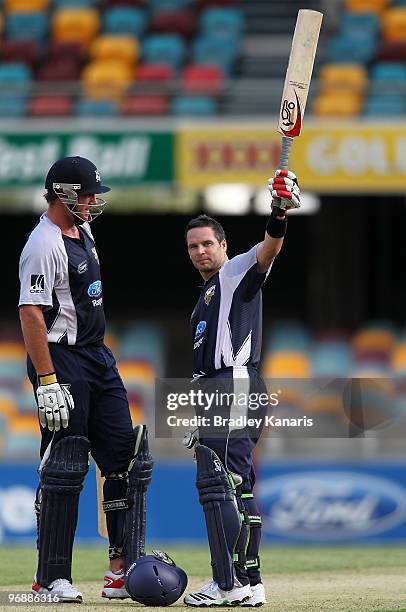 Brad Hodge of the Bushrangers celebrates after scoring a century during the Ford Ranger Cup match between the Queensland Bulls and the Victorian...