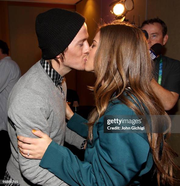 Snowboarder Torah Bright of Australia celebrates her gold medal in the women's halfpipe with her fiancee Jake Welch at the Sheraton Wall Centre...