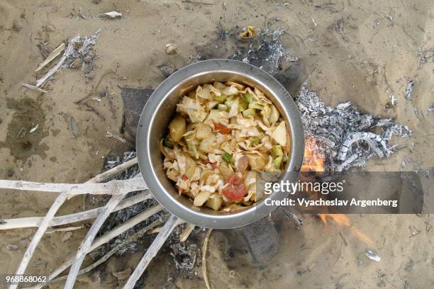cooking soup on the flame, authentic cooking in the wild, camping in thar great indian desert, rajasthan, india - weight loss journey stock pictures, royalty-free photos & images