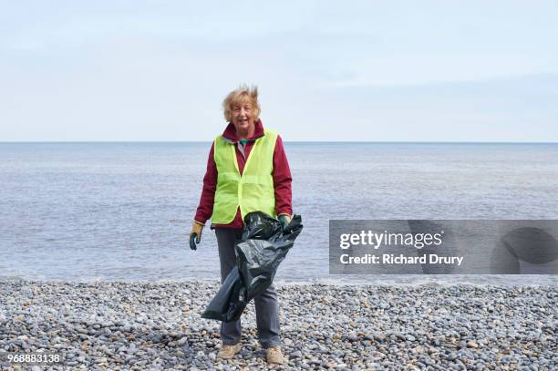 portrait of volunteer beach cleaner - beach clean up uk stock pictures, royalty-free photos & images