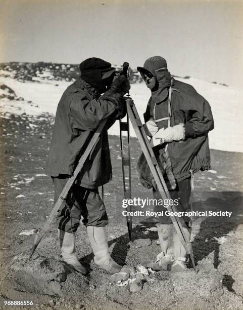 Dr Simpson taking observations on Vane Hill and Bernard Day and balloon theodolite, Antarctica, 16th March 1911. British Antarctic Expedition...