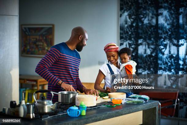 young family in kitchen - young family foto e immagini stock