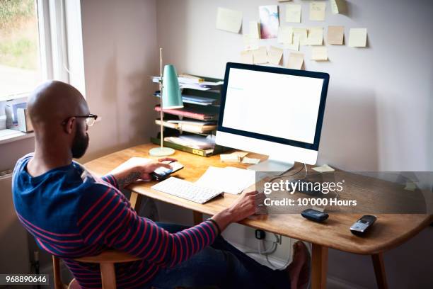 Black Man Behind Computer Photos and Premium High Res Pictures - Getty ...