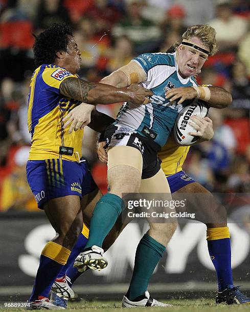 Fuifui Moimoi of the Eels tackles Aaron Sweeney of the Panthers during the NRL trial match between the Penrith Panthers and the Parramatta Eels at...