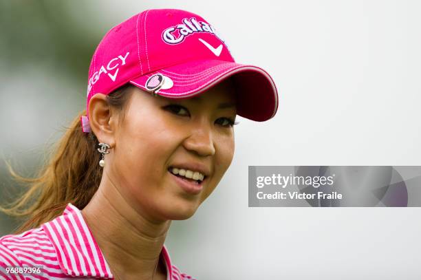 Momoko Ueda of Japan smiles on the 3rd hole during round three of the Honda PTT LPGA Thailand at Siam Country Club on February 20, 2010 in Chon Buri,...