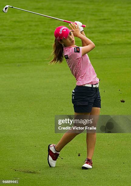 Momoko Ueda of Japan plays and approach on the 5th hole during round three of the Honda PTT LPGA Thailand at Siam Country Club on February 20, 2010...