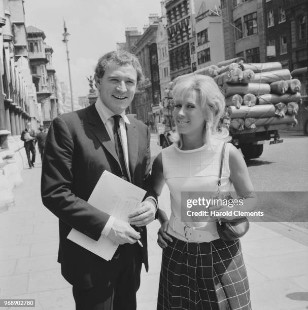 Irish actor and singer Richard Harris with his wife, Welsh socialite Elizabeth Rees-Williams outside the Royal Courts of Justice for a libel case,...