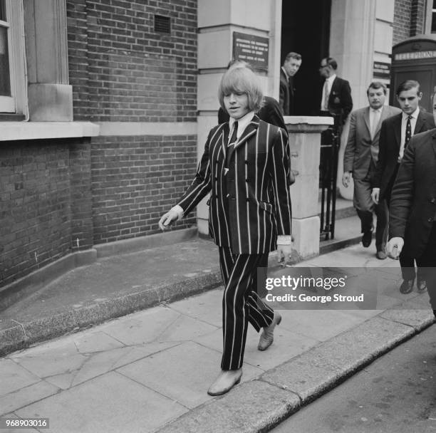 English musician Brian Jones of rock band The Rolling Stones leaving court after appearing on drugs charges, UK, 3rd June 1967.