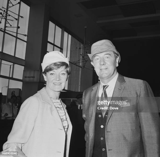 English actor Michael Redgrave with his wife, English actress Rachel Kempson at Heathrow Airport, before leaving for Venice, London, UK, 12th June...