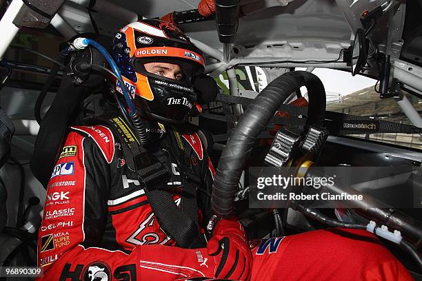 Will Davison driver of the Toll Holden Racing Team Holden sits in his car prior to qualifying for race two for round one of the V8 Supercar...