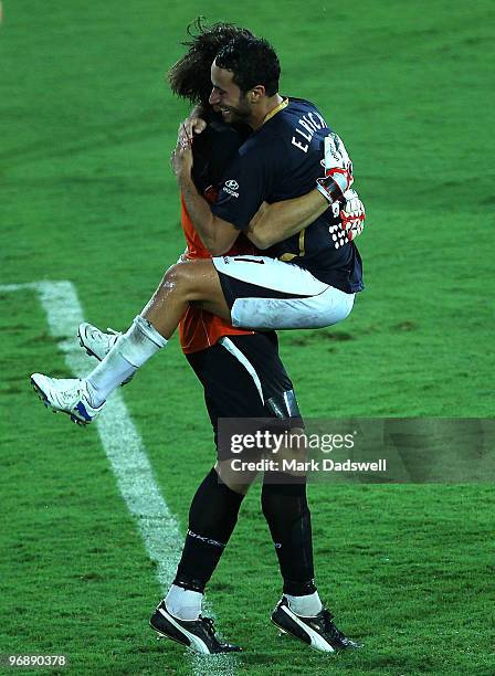 Tarek Elrich of the Jets jumps onto keeper Ben Kennedy as they celebrate their win in the A-League semi final match between Gold Coast United and the...