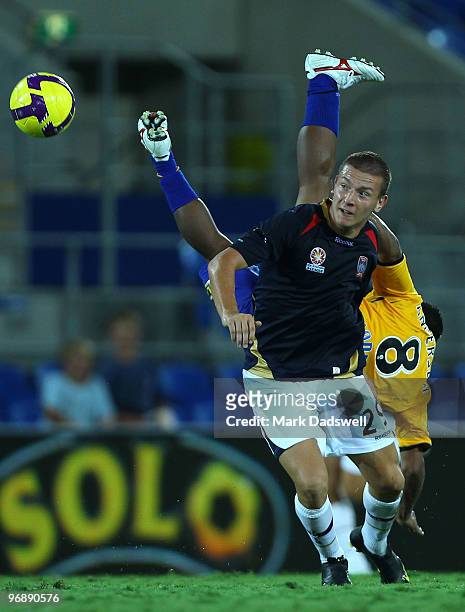Anderson Alves Da Silva of United flies over Mirjan Pavlovic of the Jets during the A-League semi final match between Gold Coast United and the...