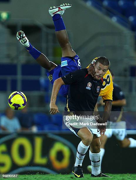 Anderson Alves Da Silva of United flies over Mirjan Pavlovic of the Jets during the A-League semi final match between Gold Coast United and the...