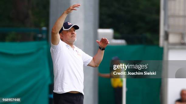 Coach Willi Breuer of Koeln gestures during the Allianz Frauen Bundesliga match between VfL Wolfsburg and 1. FC Koeln at AOK-Stadion on June 3, 2018...