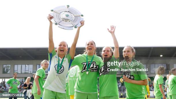 Joelle Wedemeyer, Sara Bjoerk Gunnarsdottir, Katharina Baunach and Ewa Pajor of Wolfsburg celebrate the champion chip after the Allianz Frauen...