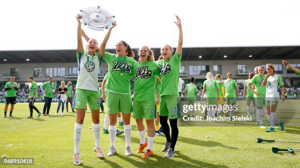 Joelle Wedemeyer, Sara Bjoerk Gunnarsdottir, Katharina Baunach and Ewa Pajor of Wolfsburg celebrate the champion chip after the Allianz Frauen...