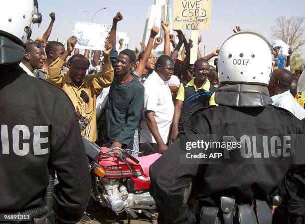 People attend a rally in Niger's capital Niamey on February 20, 2010 in support of their new military rulers after a coup ousted the strongman of the...