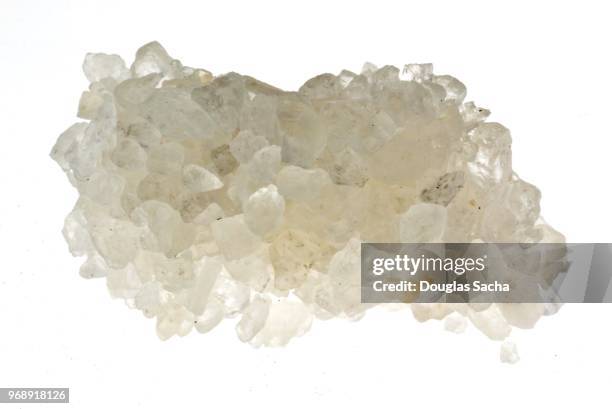 close-up of rock salt against white background - spice store stock pictures, royalty-free photos & images