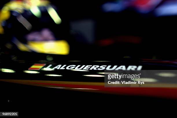 Jaime Alguersuari of Spain and Scuderia Toro Rosso sits in his car in the garage during winter testing at the Circuito De Jerez on February 19, 2010...
