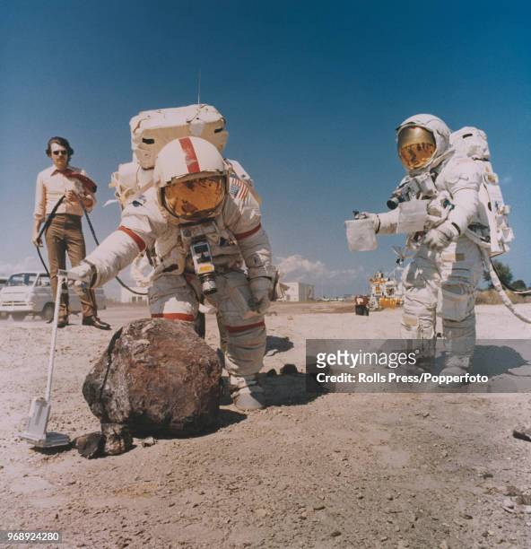 American astronauts and crew of the Apollo 16 manned mission to the Moon, Mission Commander John Young and Lunar Module pilot Charles Duke, wearing...