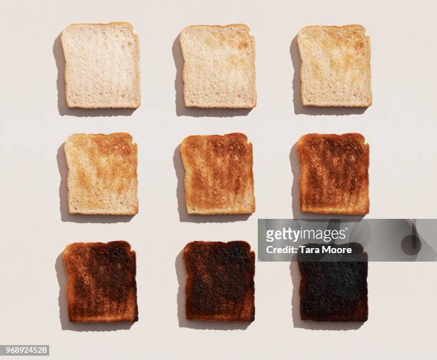 bread toasted in different ways - burnt stockfoto's en -beelden