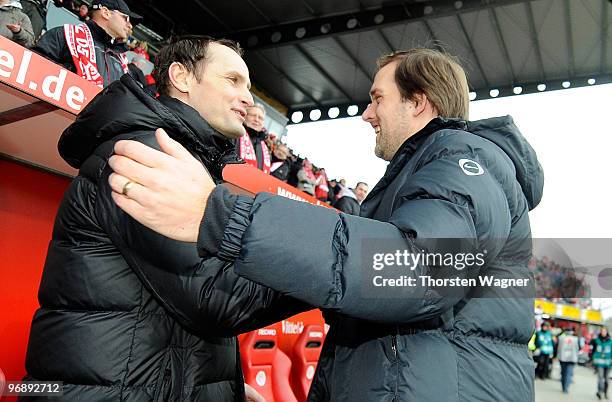 Head coach Heiko Herrlich of Bochum shake hands with head coach Thomas Tuchel of Mainz in prior to the Bundesliga match between FSV Mainz 05 and VFL...