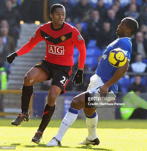 Antonio Valencia of Manchester United clashes with Sylvain Distin of Everton during the FA Barclays Premier League match between Everton and...