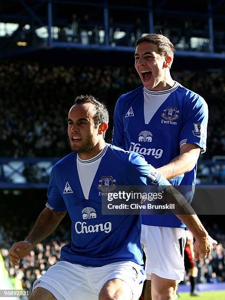 Dan Gosling of Everton celebrates scoring his team's second goal with Landon Donovan during the Barclays Premier League match between Everton and...