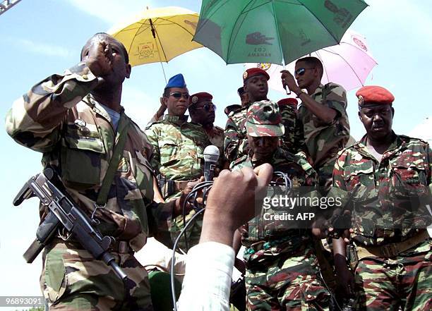 People greet members of the military junta during a rally in Niger's capital Niamey on February 20, 2010 in support of their new military rulers...