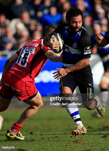 Joe Maddock of Bath runs through the tackle from Chris Latham of Worcester during the Guinness Premiership match between Bath and Worcester at the...