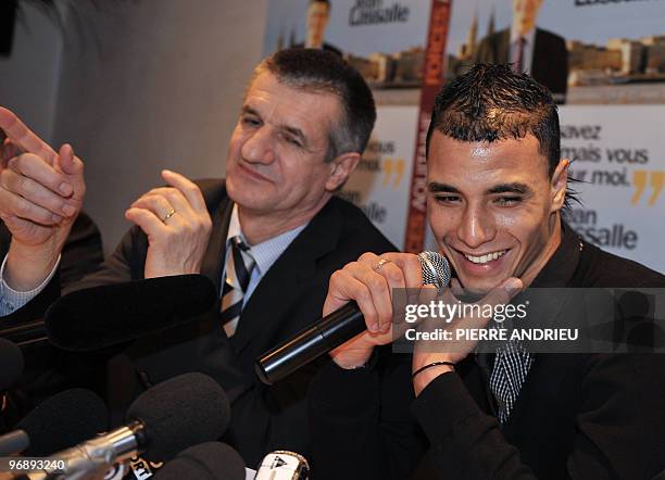 Bordeaux' French-Morrocan forward Marouane Chamakh and French head of list for "Forces Aquitaine" Party Jean Lassalle, for the Gironde Region attend...