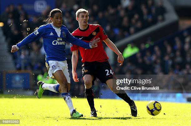 Steven Pienaar of Everton competes for the ball with Darren Fletcher of Manchester United during the Barclays Premier League match between Everton...