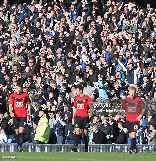 Everton fans celebrate Dan Gosling scoring their second goal during the FA Barclays Premier League match between Everton and Manchester United at...