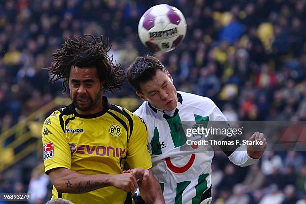 Patrick Owomoyela of Dortmund and Hanno Balitsch of Hannover head for the ball during the Bundesliga match between Borussia Dortmund and Hannover 96...