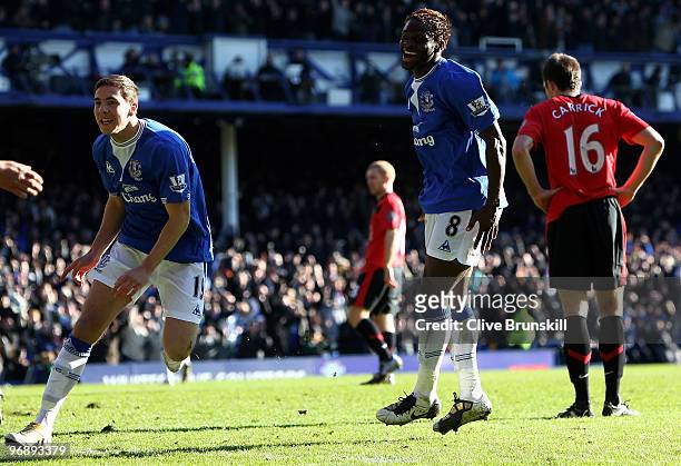 Dan Gosling of Everton celebrates scoring his team's second goal with Louis Saha during the Barclays Premier League match between Everton and...